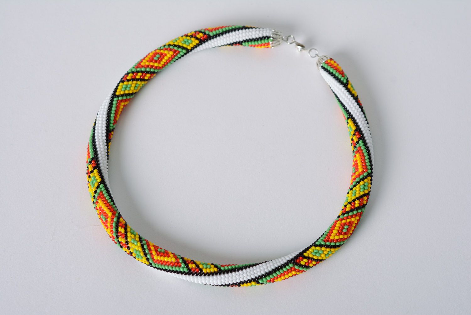Festive handmade woven beaded cord necklace with geometric pattern photo 1
