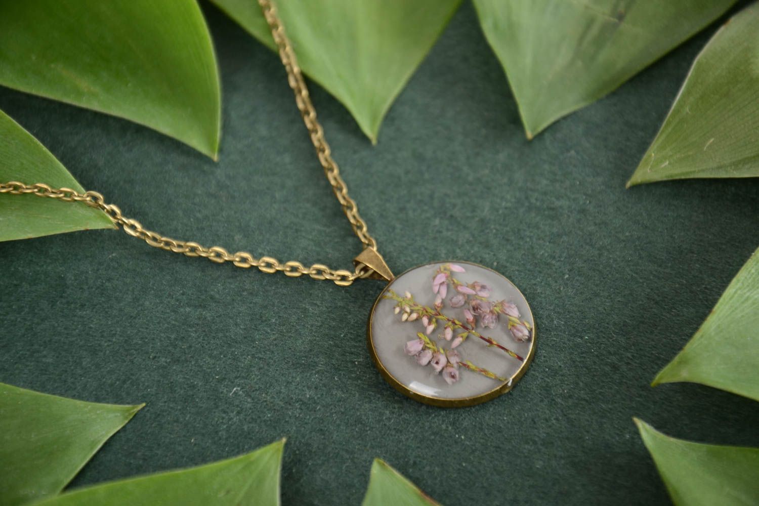 Beautiful round handmade epoxy resin neck pendant with real flowers photo 1