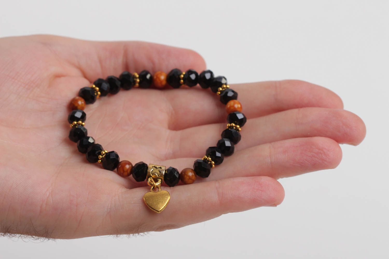 Stretchy beaded  black and cherry beads  gemstone bracelet with heart shape centerpiece photo 5