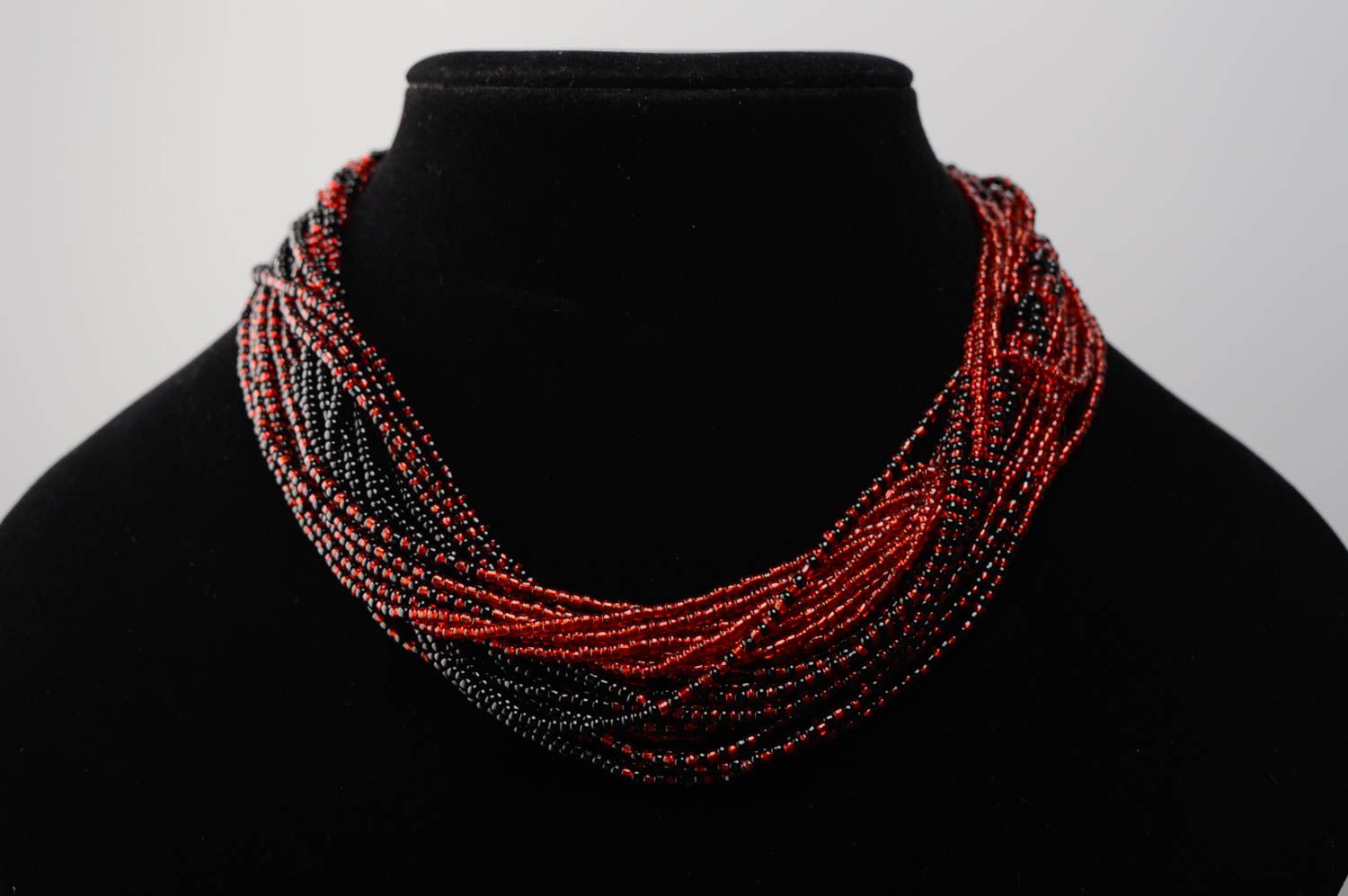 Multi-row beaded necklace of red and black colors photo 2