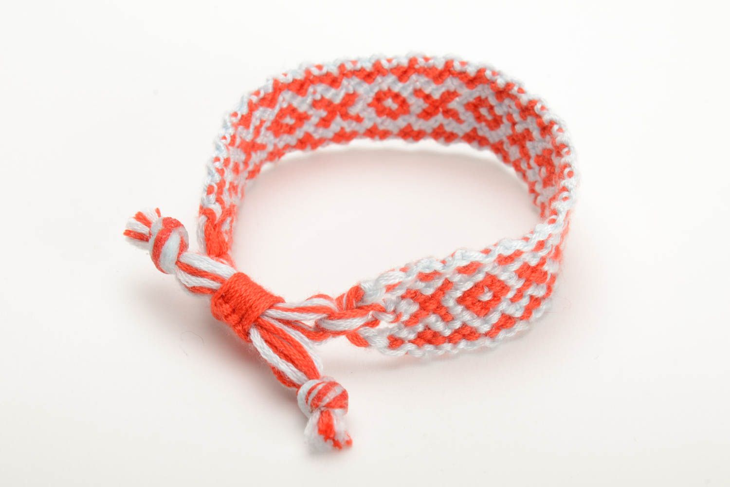 Red and white handmade bright thin bracelet woven of embroidery floss photo 2