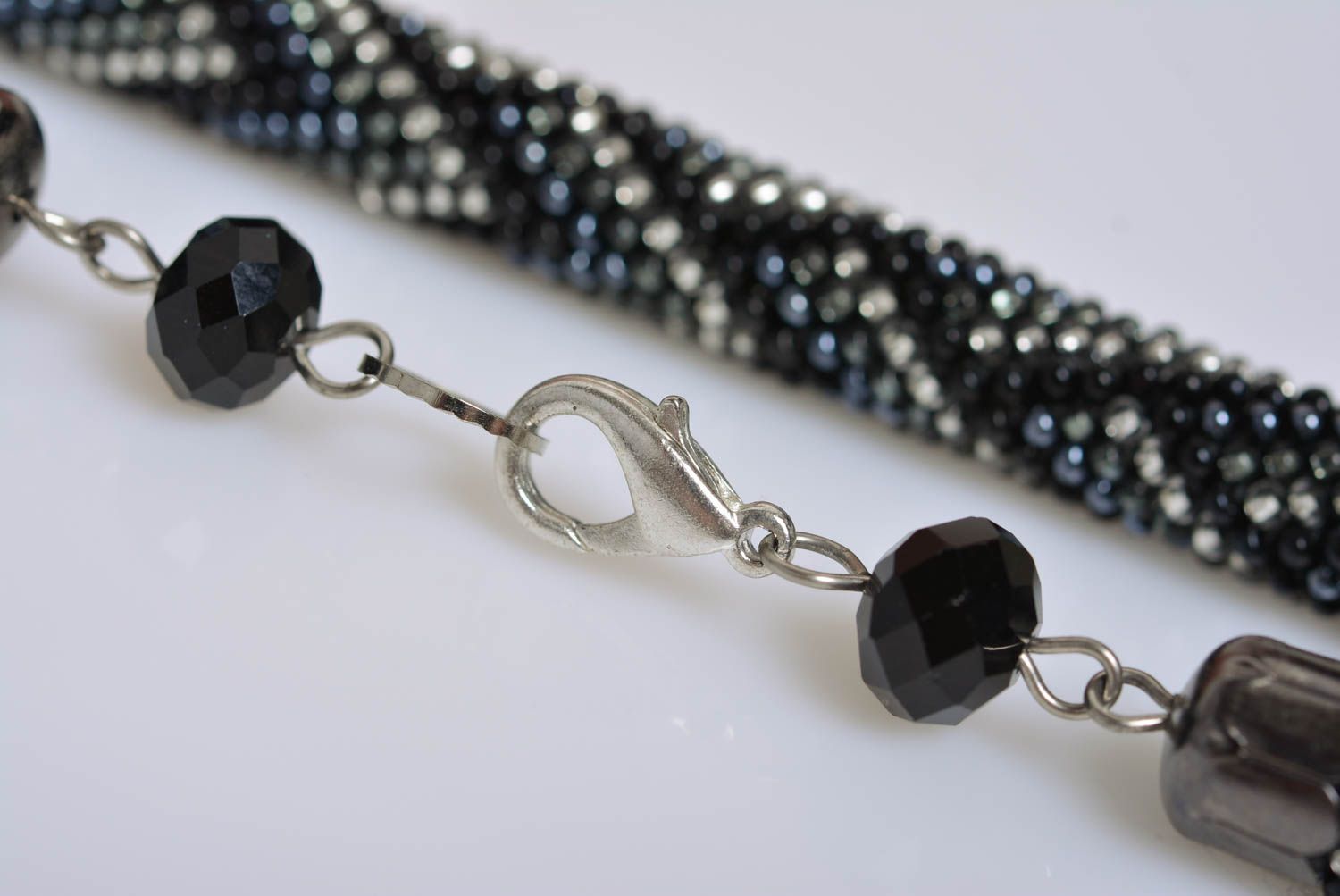 Handmade designer bead woven cord necklace with laconic dark geometric ornament photo 5