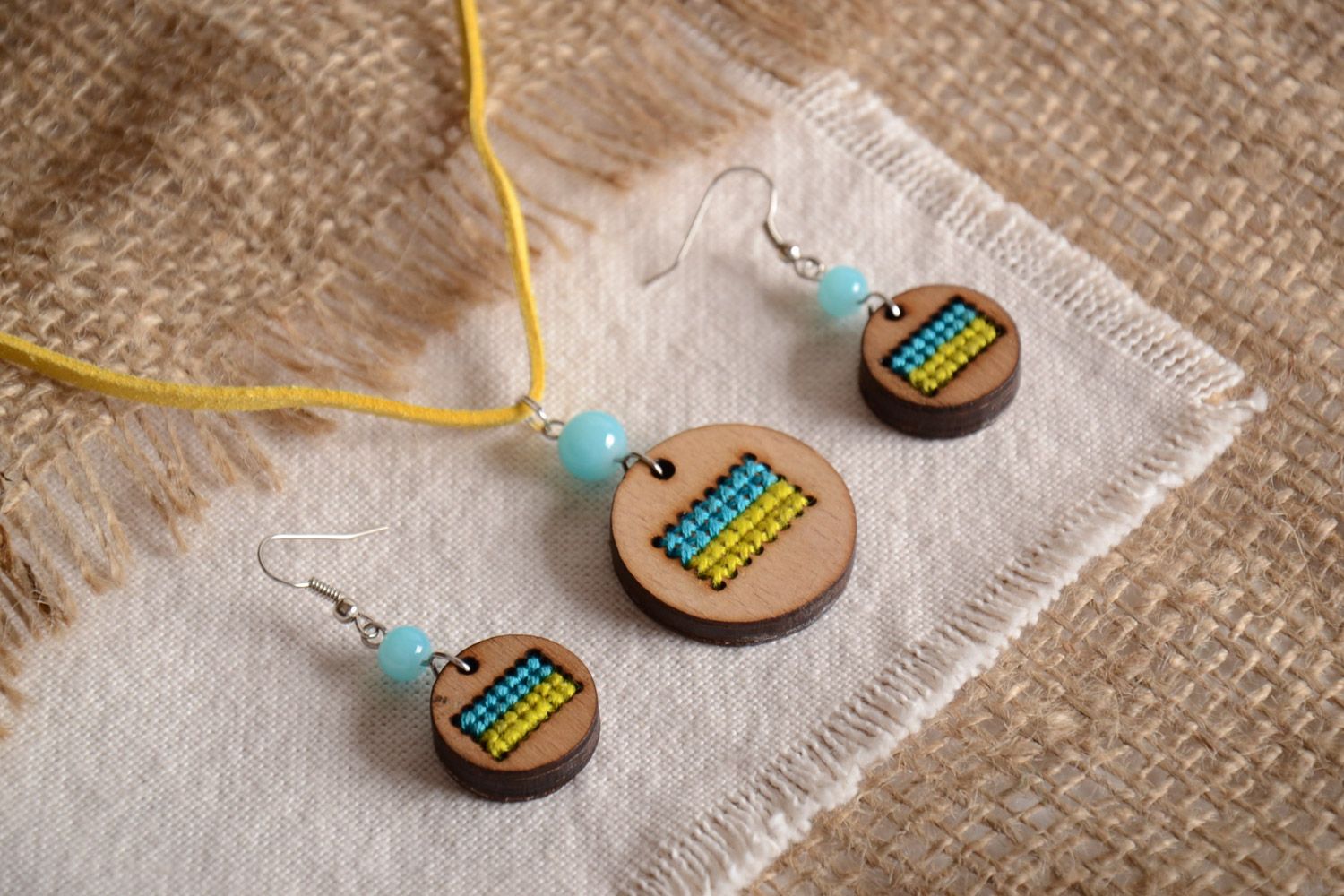 Wooden handmade jewelry set of 2 pieces yellow with blue embroidery earrings and pendant photo 1
