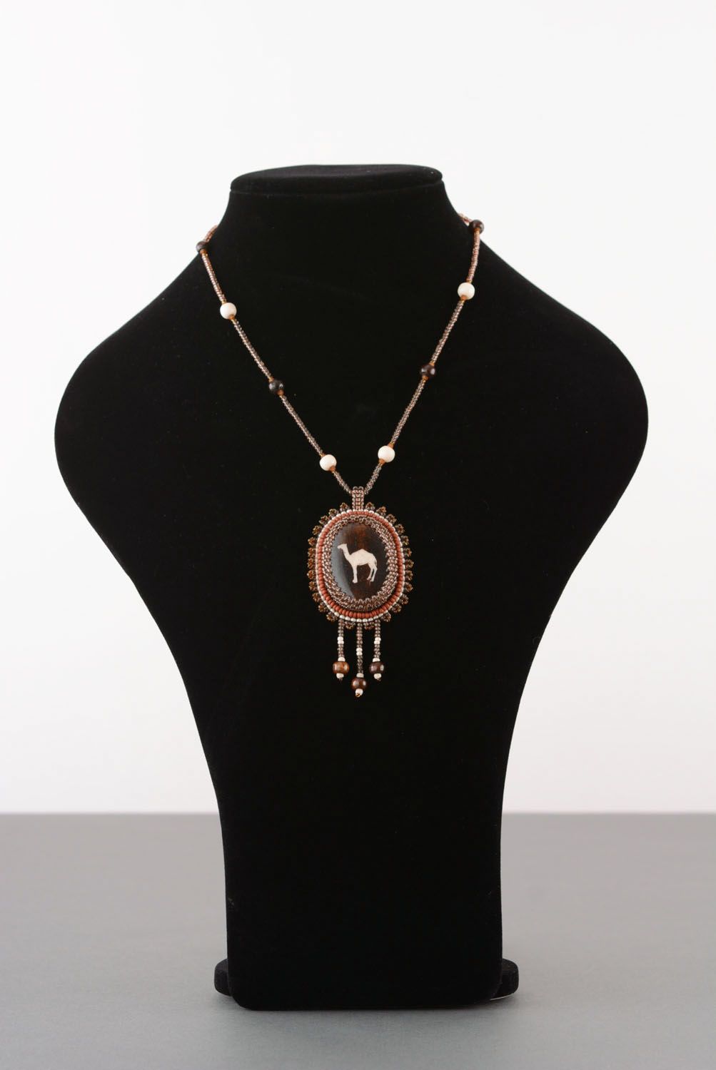 Beaded pendant with camel bone photo 2