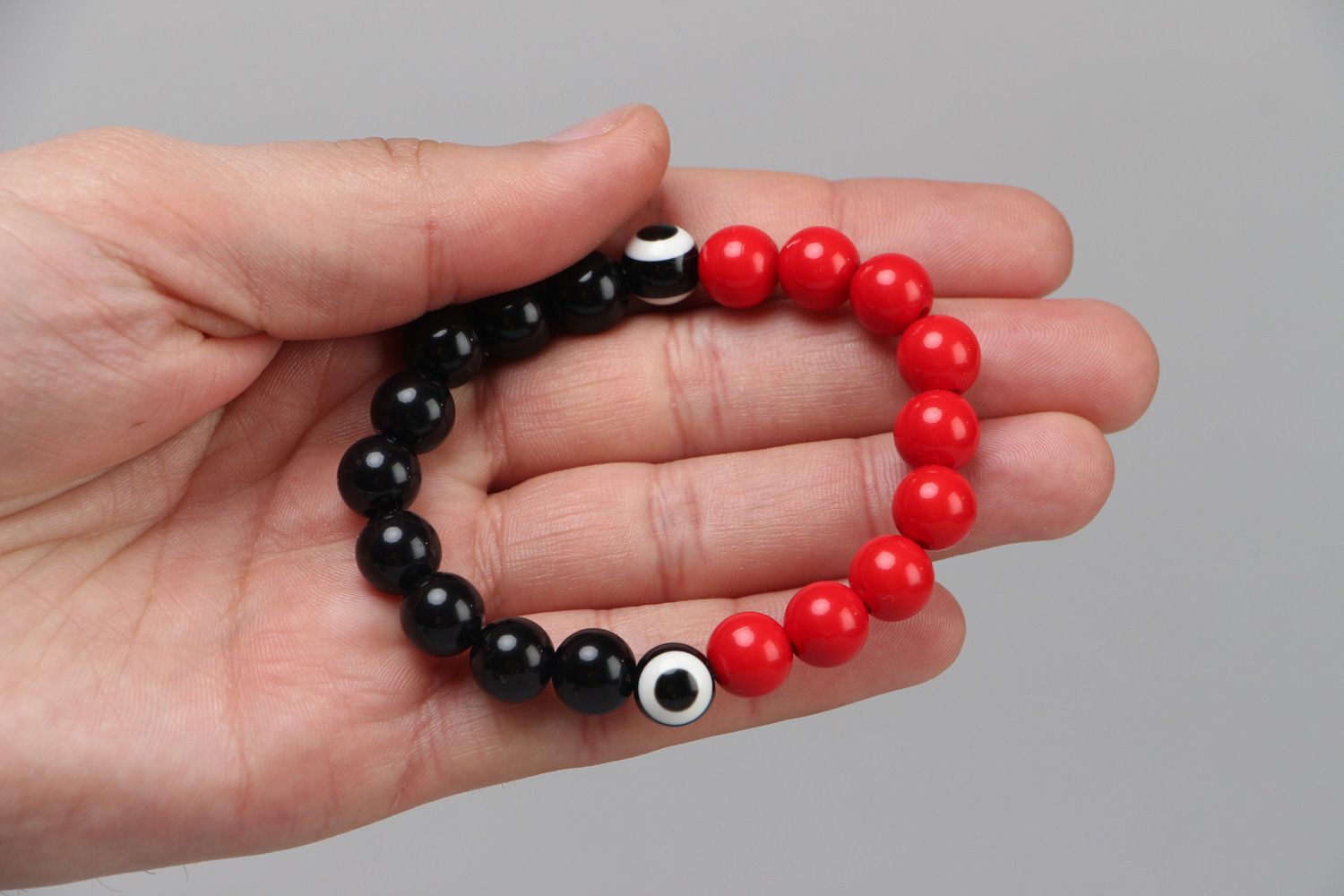 Handmade stretch wrist bracelet with red and black plastic beads for women photo 3