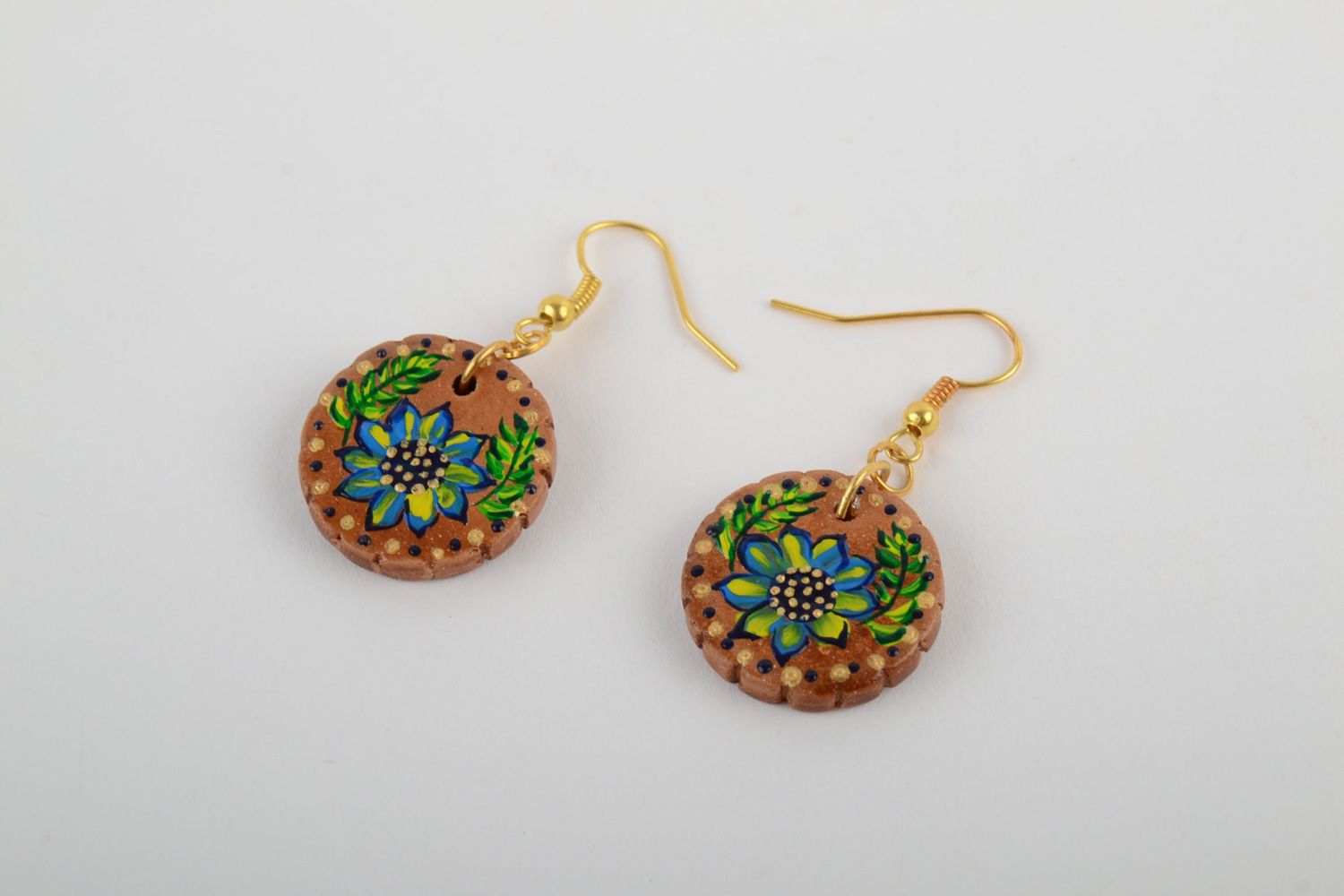 Handmade festive round ceramic earrings painted with acrylics in ethnic style photo 3