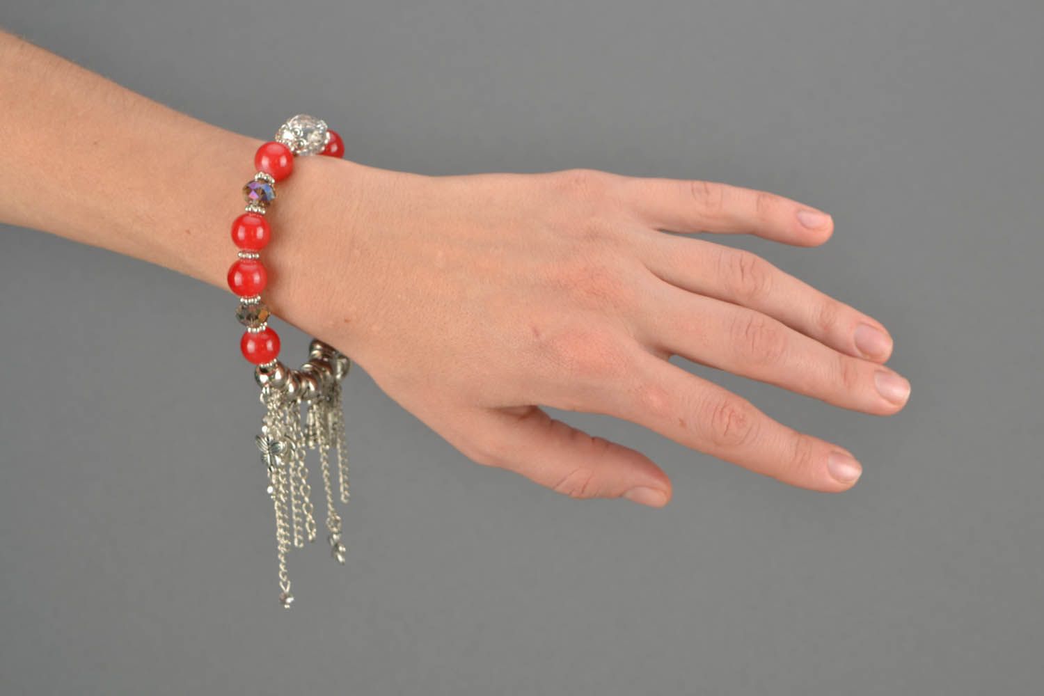 Red bracelet with charms photo 3