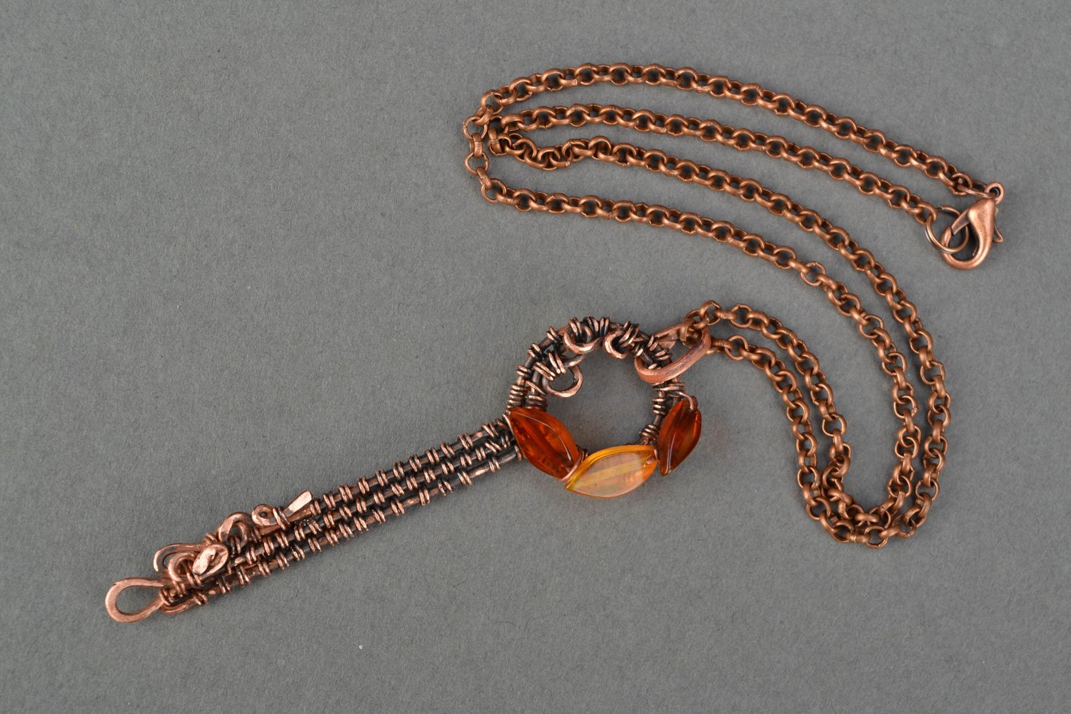 Wire wrap copper pendant with natural stone Amber Key photo 3