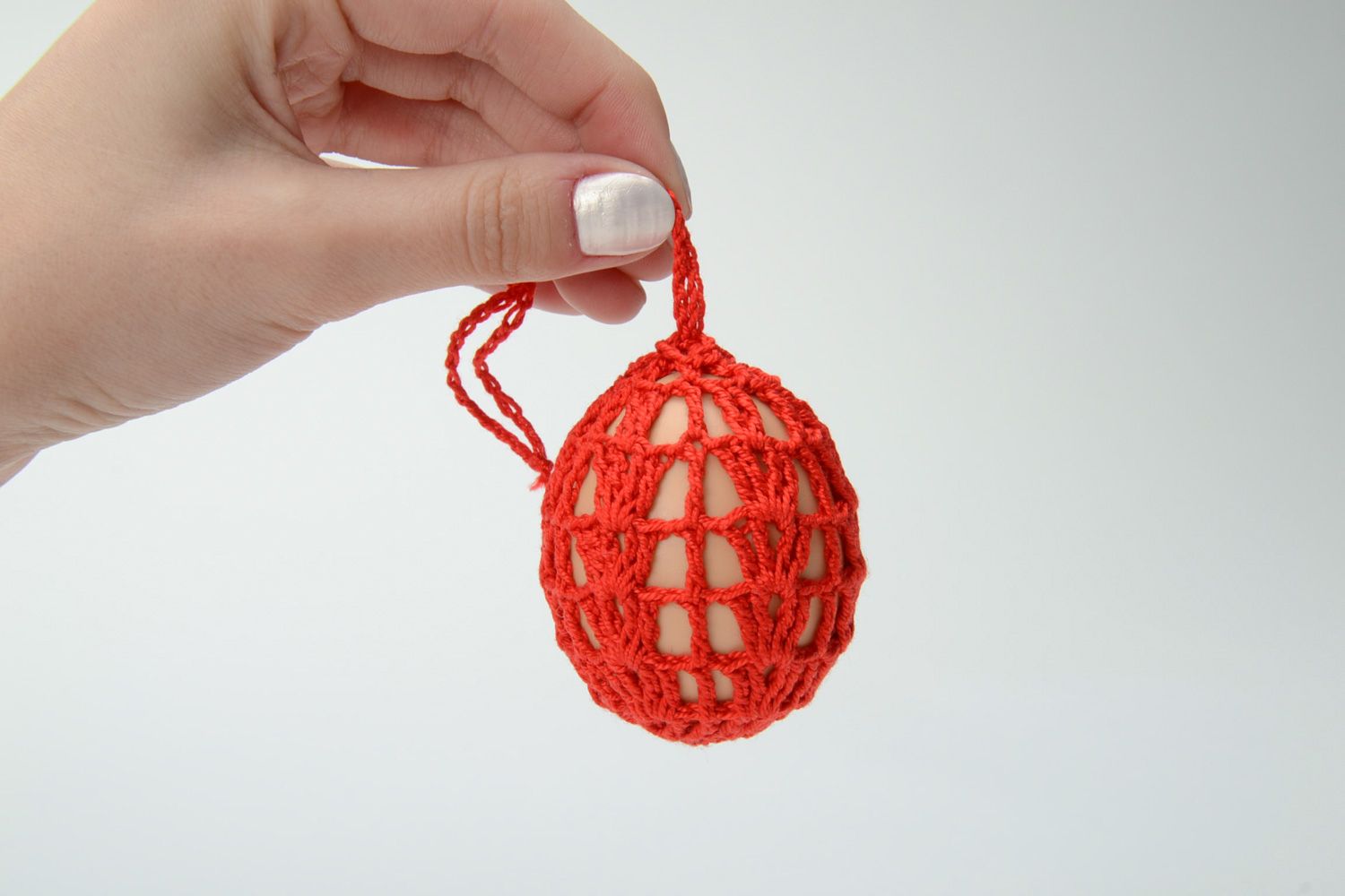 Homemade red decorative Easter egg woven over with threads photo 5
