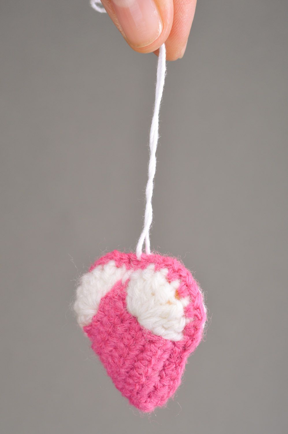 Handmade heart-shaped keychain crocheted of pink and white semi-woolen threads photo 3