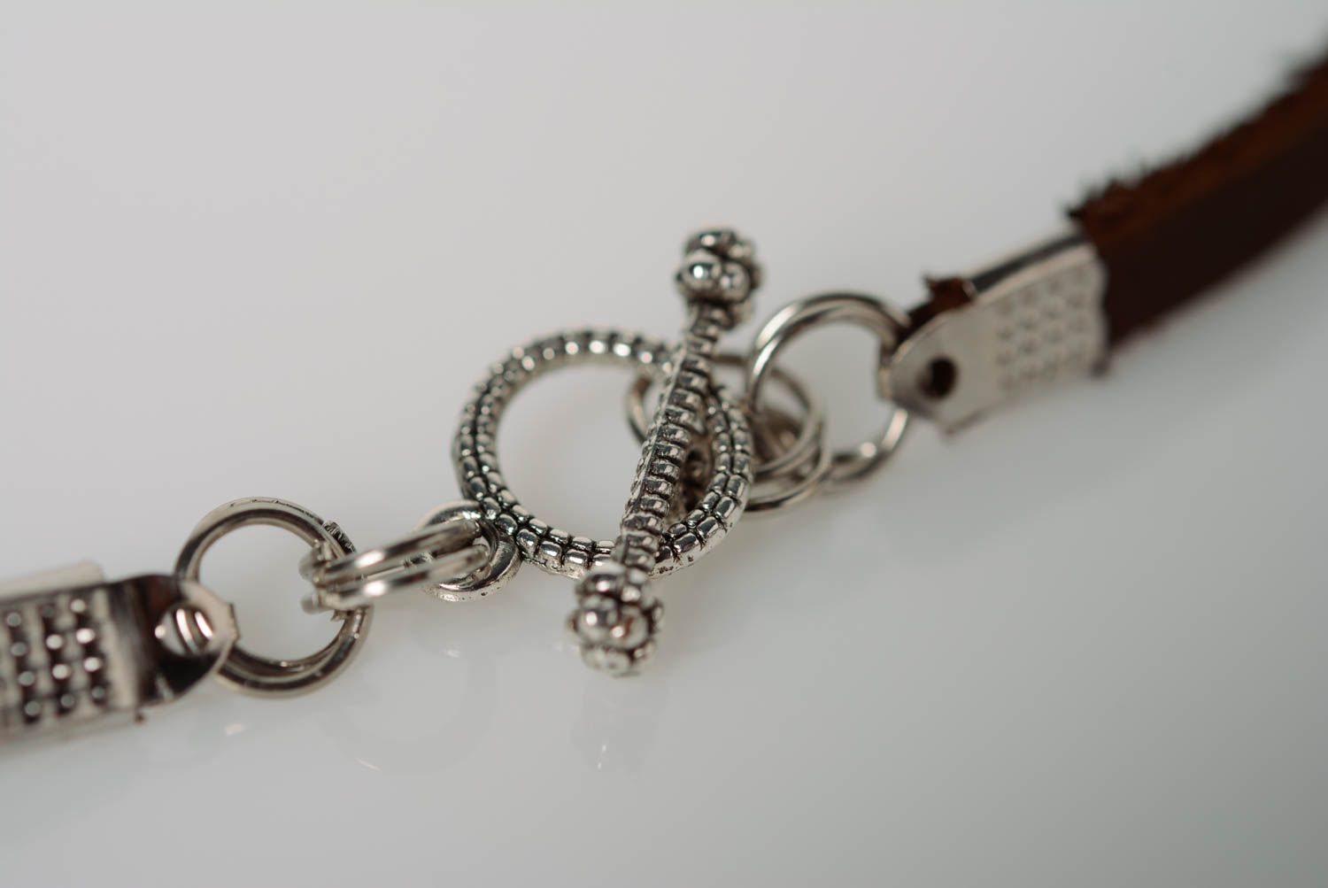 Unusual handmade designer leather cord bracelet with glass cross photo 5