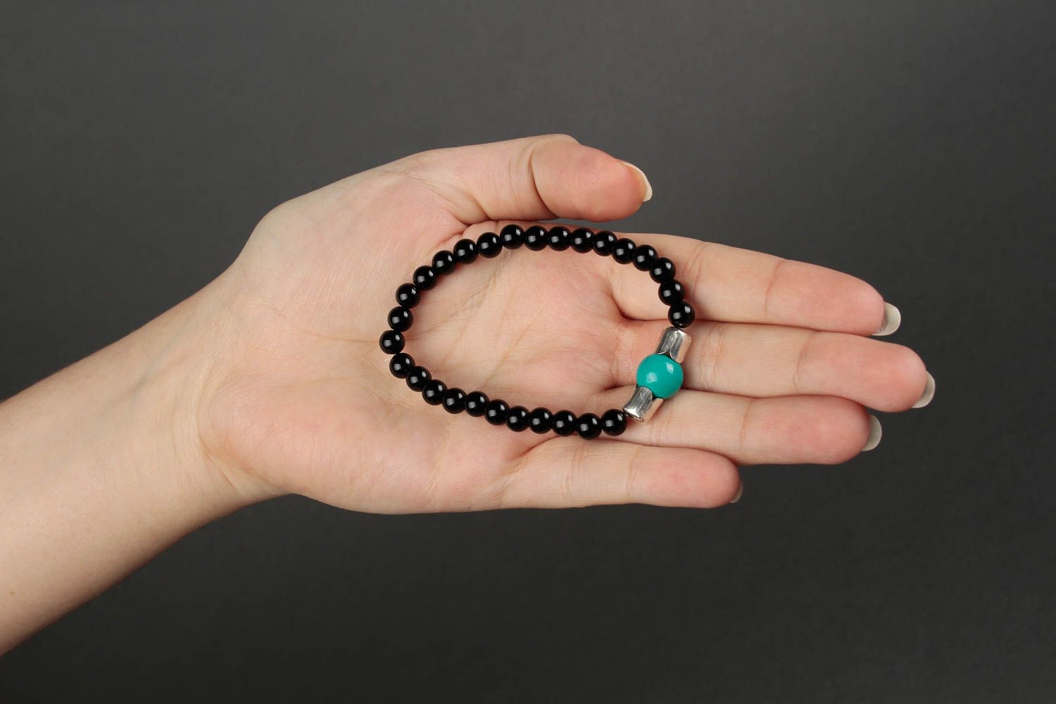 Black beads bracelet on elastic cord and center malachite bead. Unisex bracelet photo 4