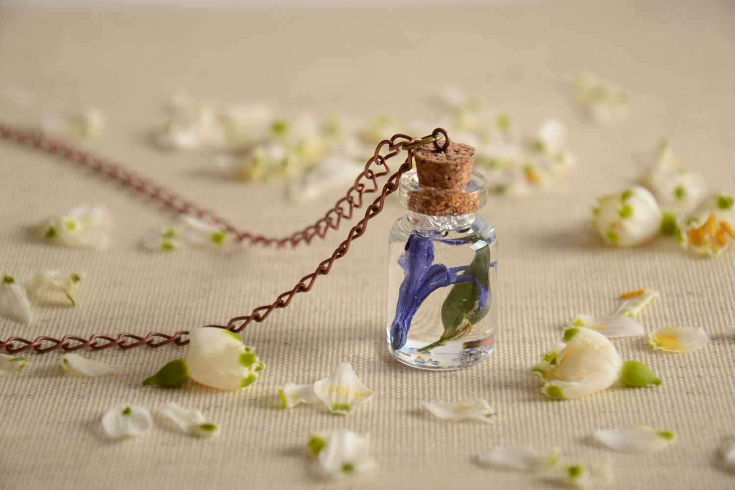 Handmade epoxy resin pendant with real flowers inside in the shape of vial photo 1