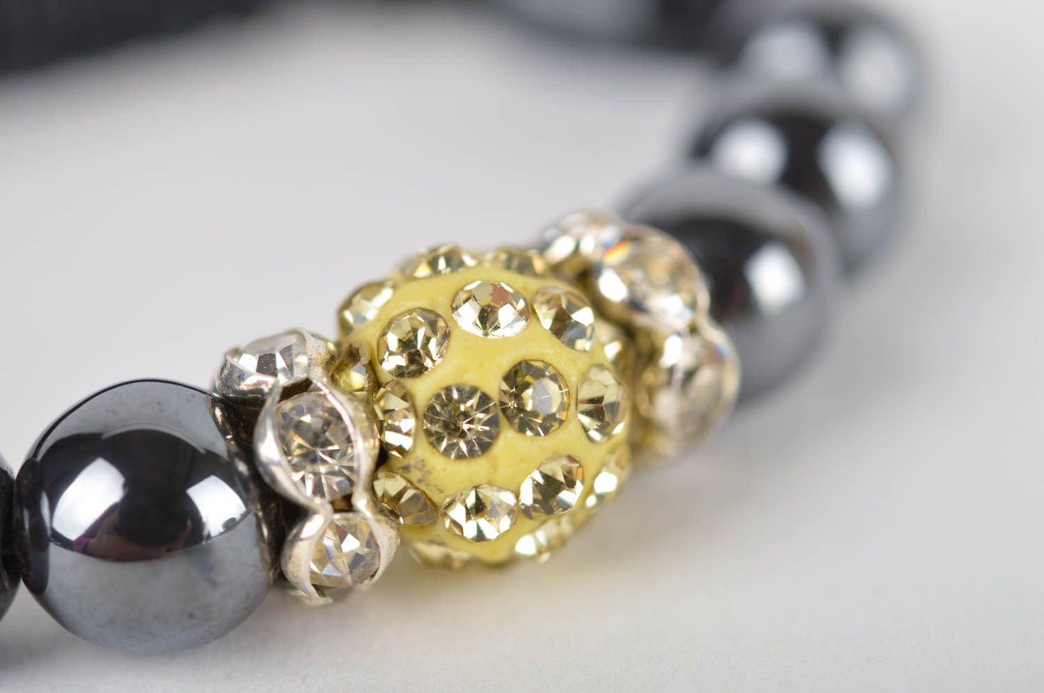 Handmade black beads strand bracelet on black cord with golden centerpiece for women photo 3