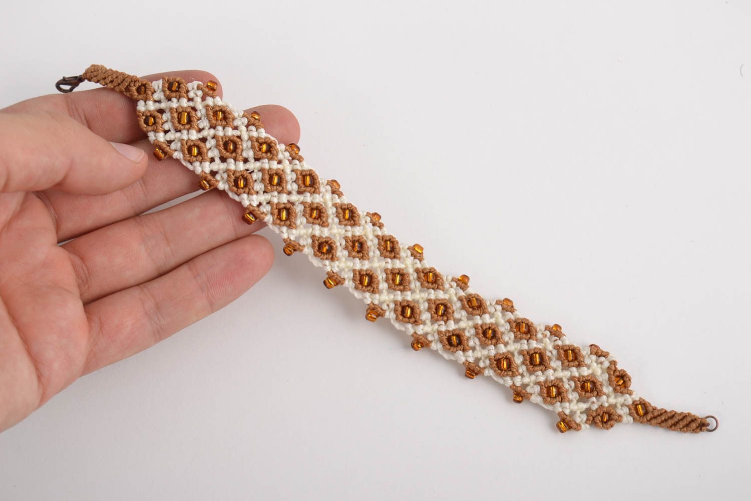 Handmade designer macrame wrist bracelet woven of synthetic threads with beads photo 3