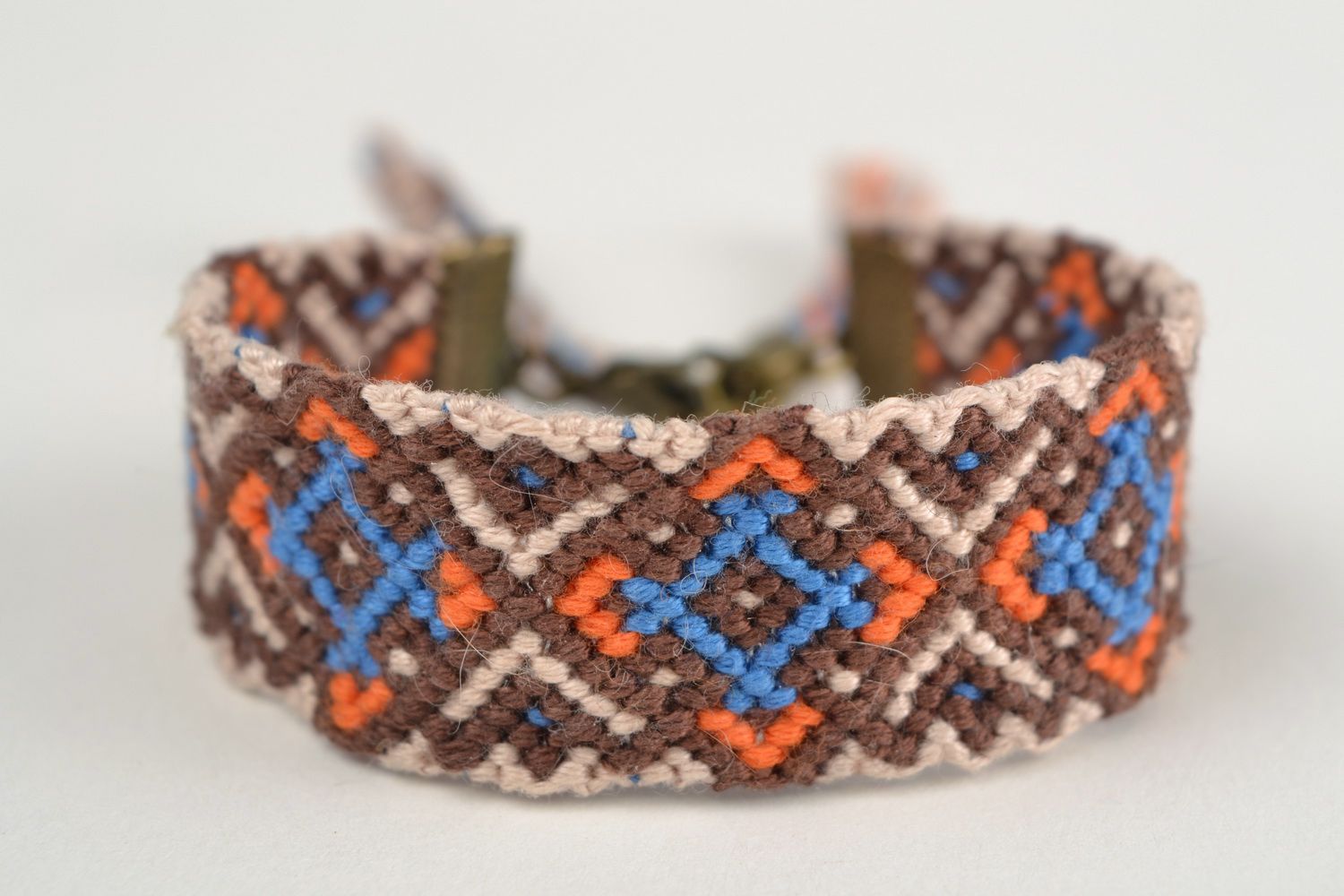 Handmade friendship macrame woven wrist bracelet with colorful ornament photo 3