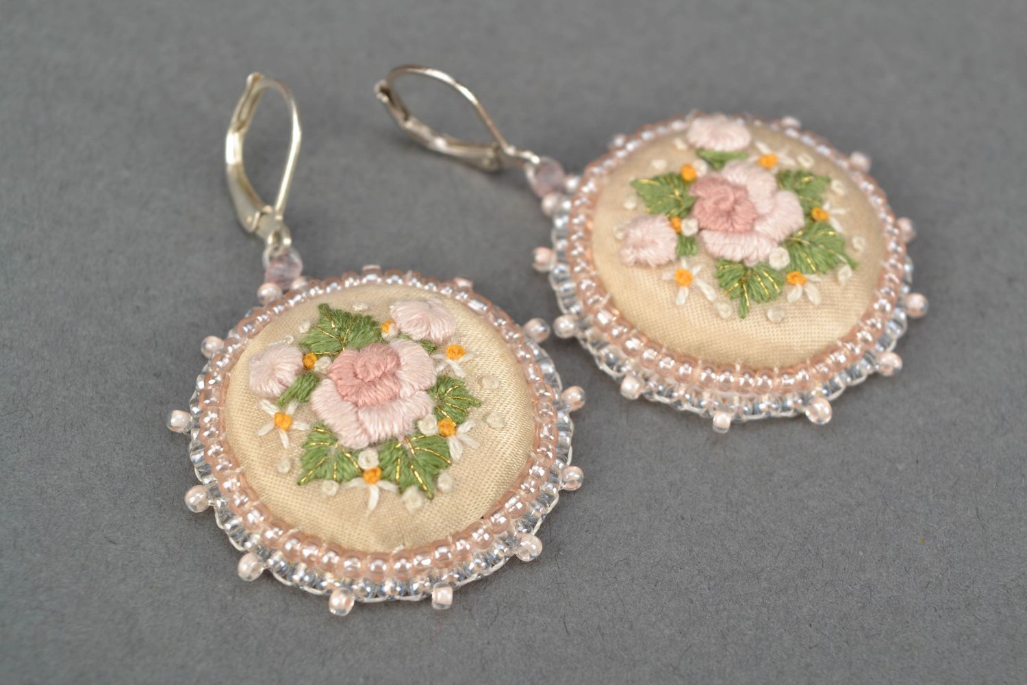Round embroidered earrings on leather basis photo 4