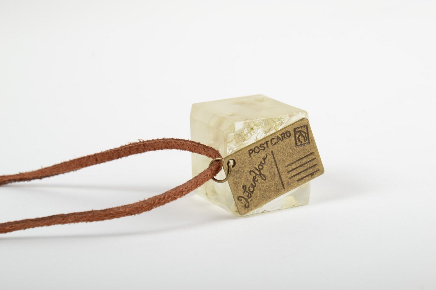 Handmade neck pendant on suede cord with real flowers coated with epoxy resin in the shape of cube photo 4