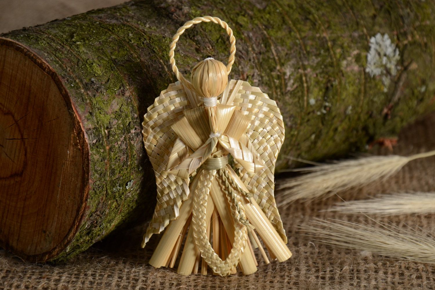 Handmade wall hanging straw decoration in the shape of angel in eco style photo 1