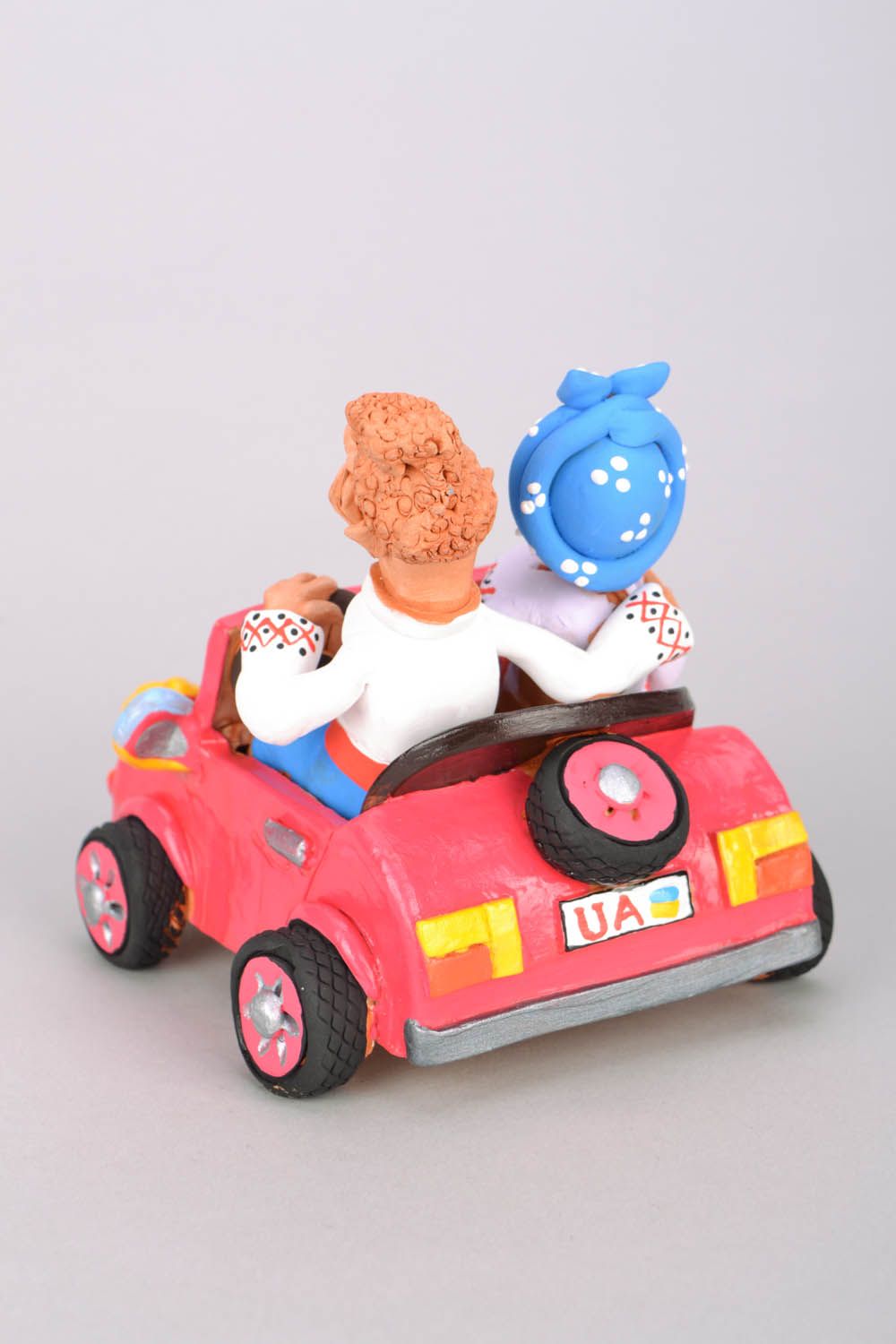 Clay figurine Cossack and his Wife in a Car photo 3