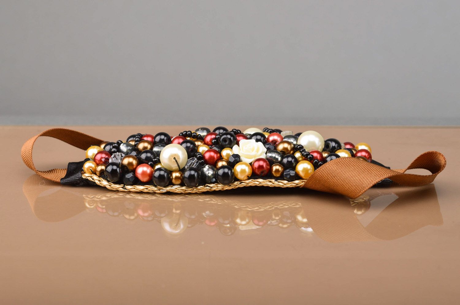 Handmade dark bead embroidered wrist bracelet with felt basis and ribbons  photo 1