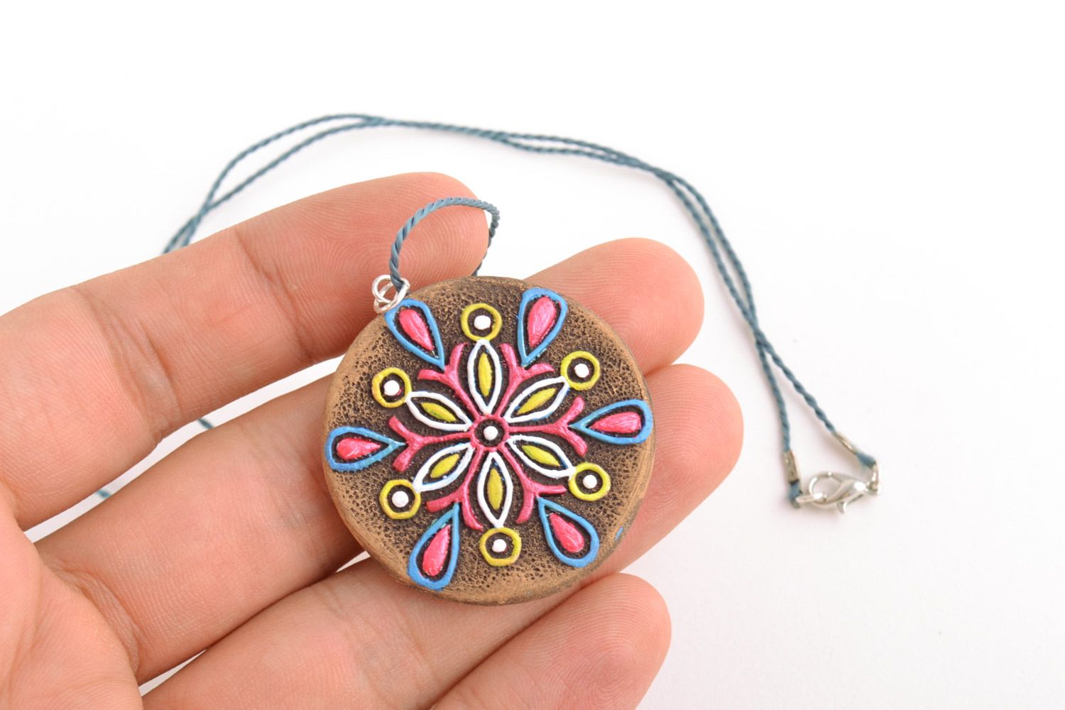 Round handmade clay neck pendant painted with acrylics with flower photo 2