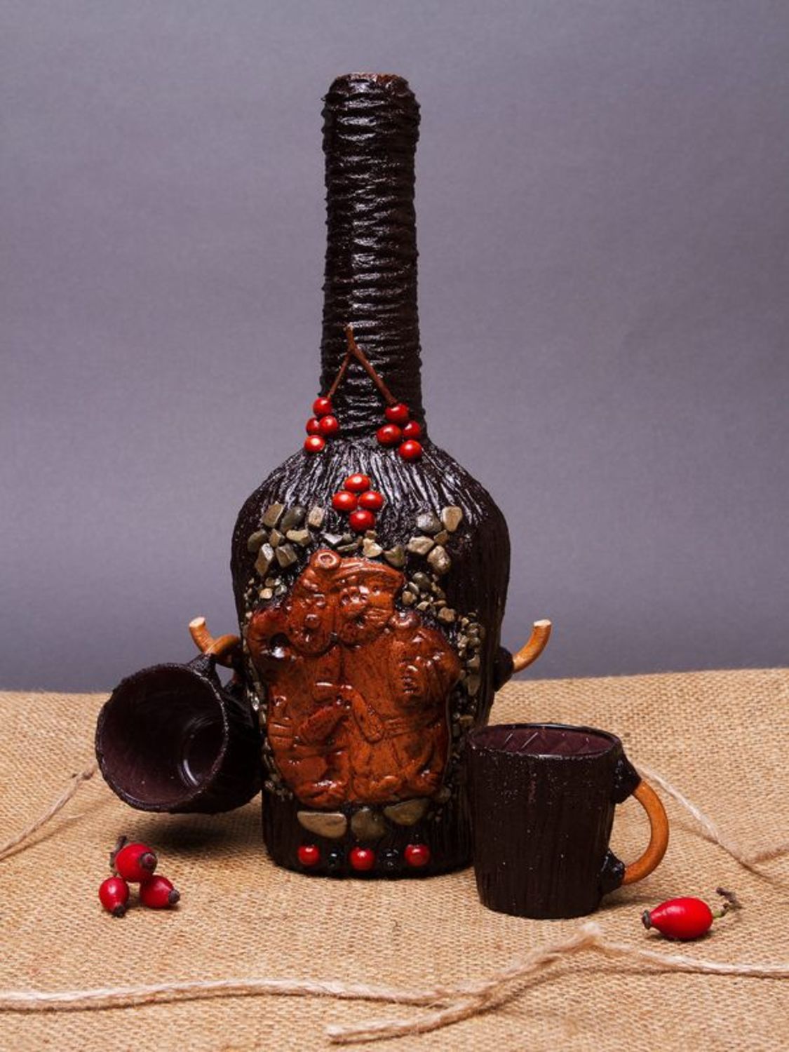 Decorative bottle with two cups photo 1