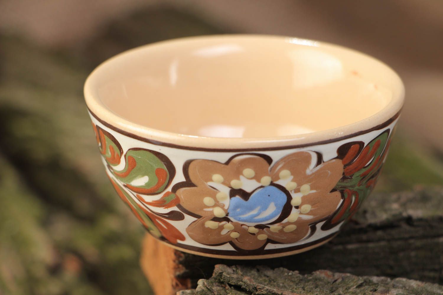 Handmade decorative small ceramic bowl ornamented with colorful glaze for sauces photo 1