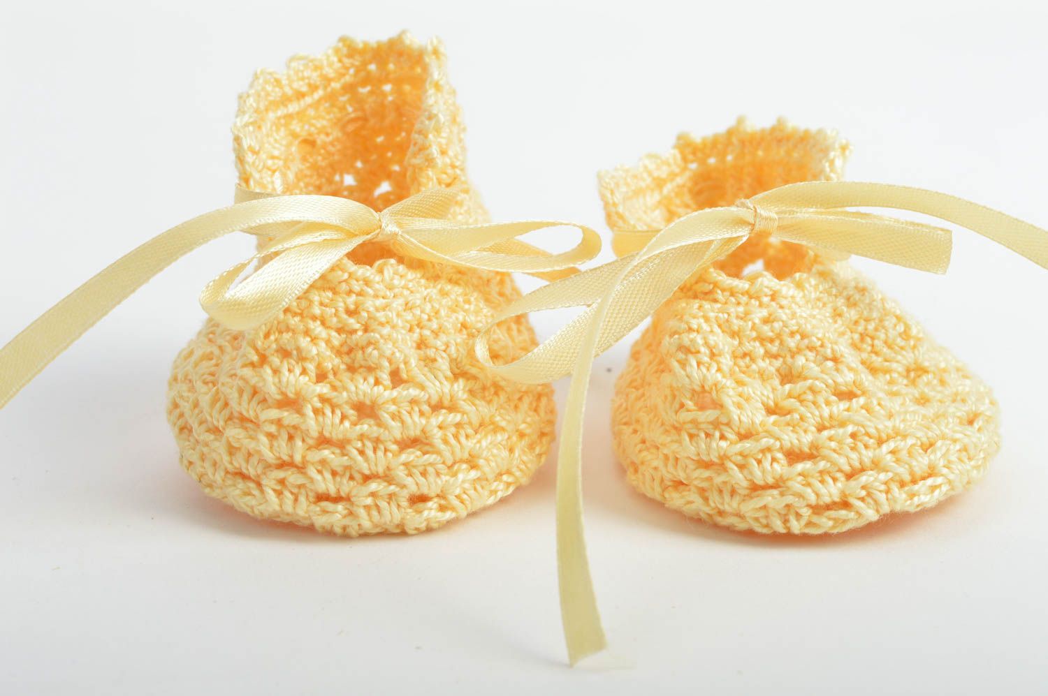 Yellow cute crocheted baby booties with bows made of cotton for little girls photo 2