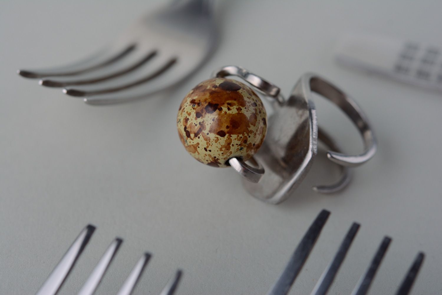 Handmade metal ring made of cupronickel fork with round artificial stone photo 1