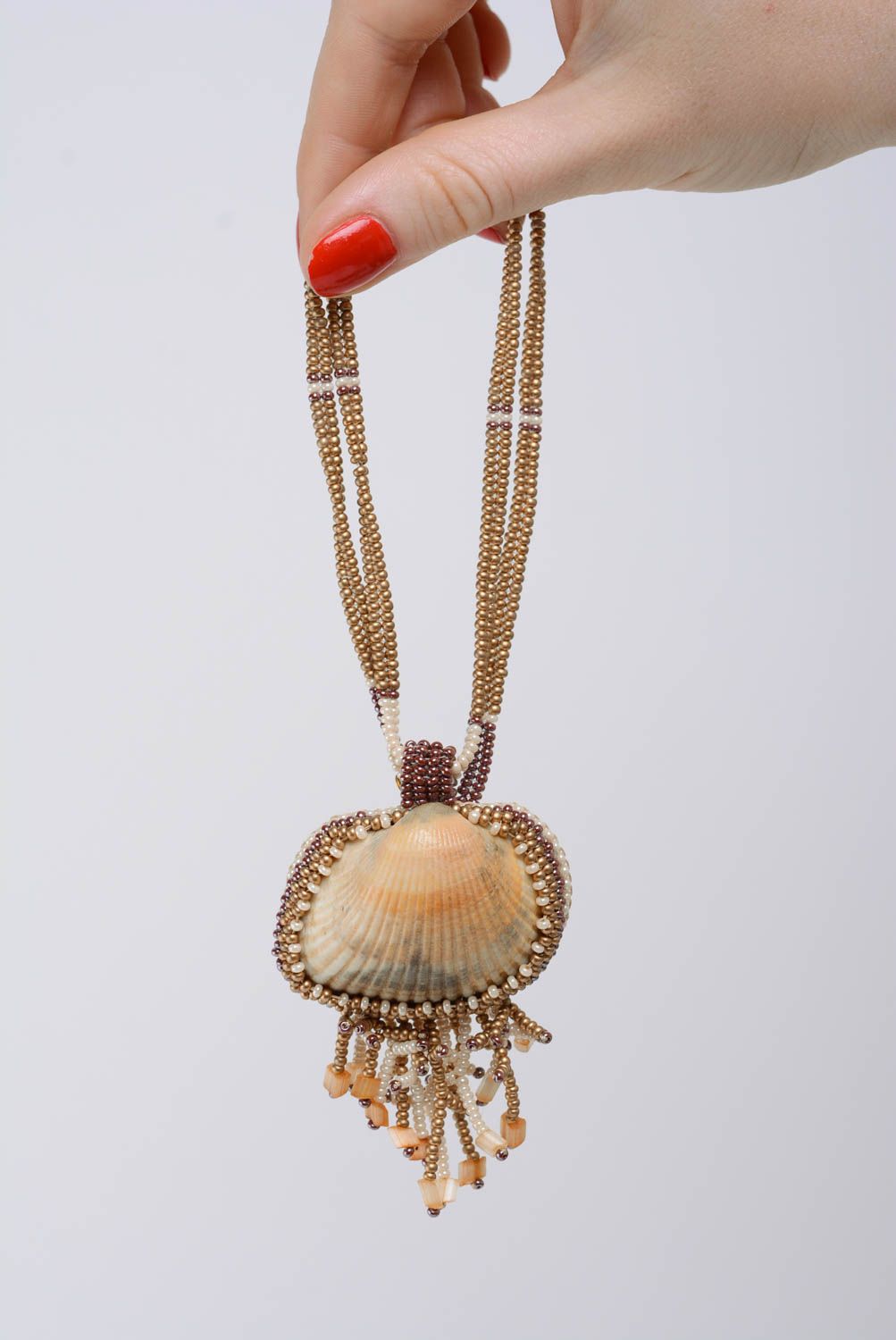Unusual handmade women's designer beige beaded pendant with seashell photo 3