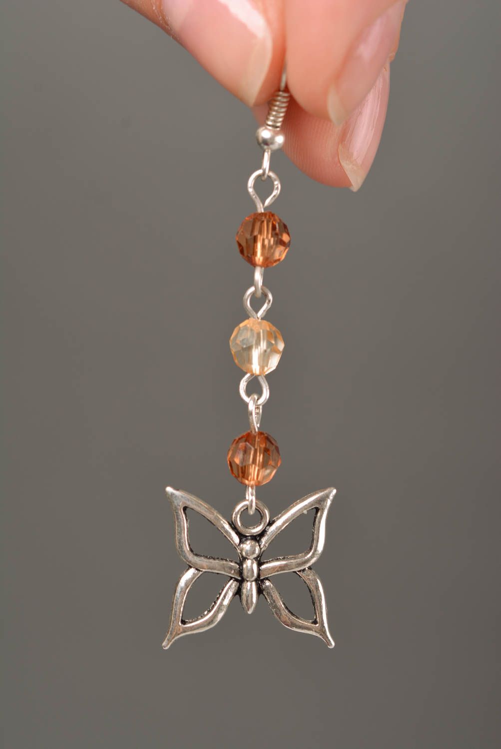 Handmade designer long metal dangle earrings with faceted beads and butterflies photo 5