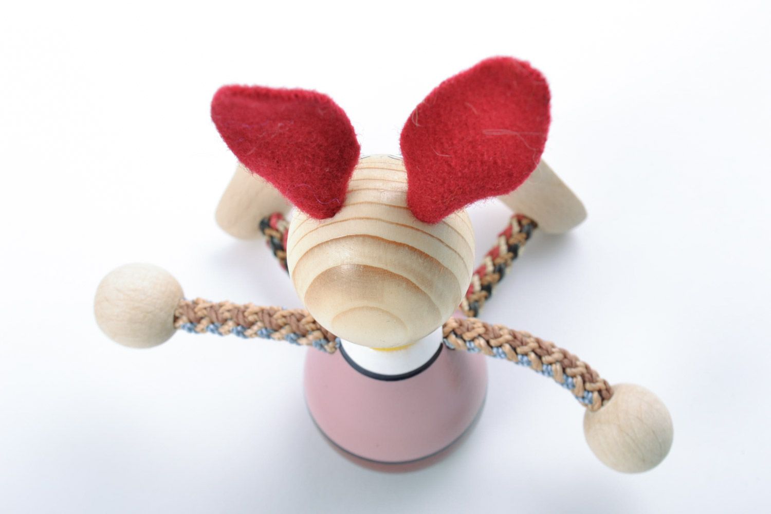 Small funny painted toy hand made of beech wood rabbit with red ears for kids photo 5
