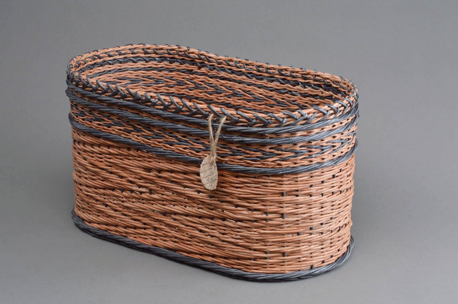 Handmade beautiful decorative basket woven of paper rod with patterned bottom photo 1