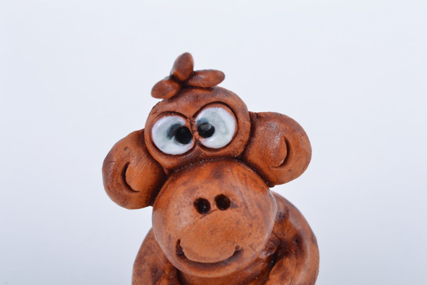 Small handmade ceramic figurine in the shape of monkey for interior decoration photo 3