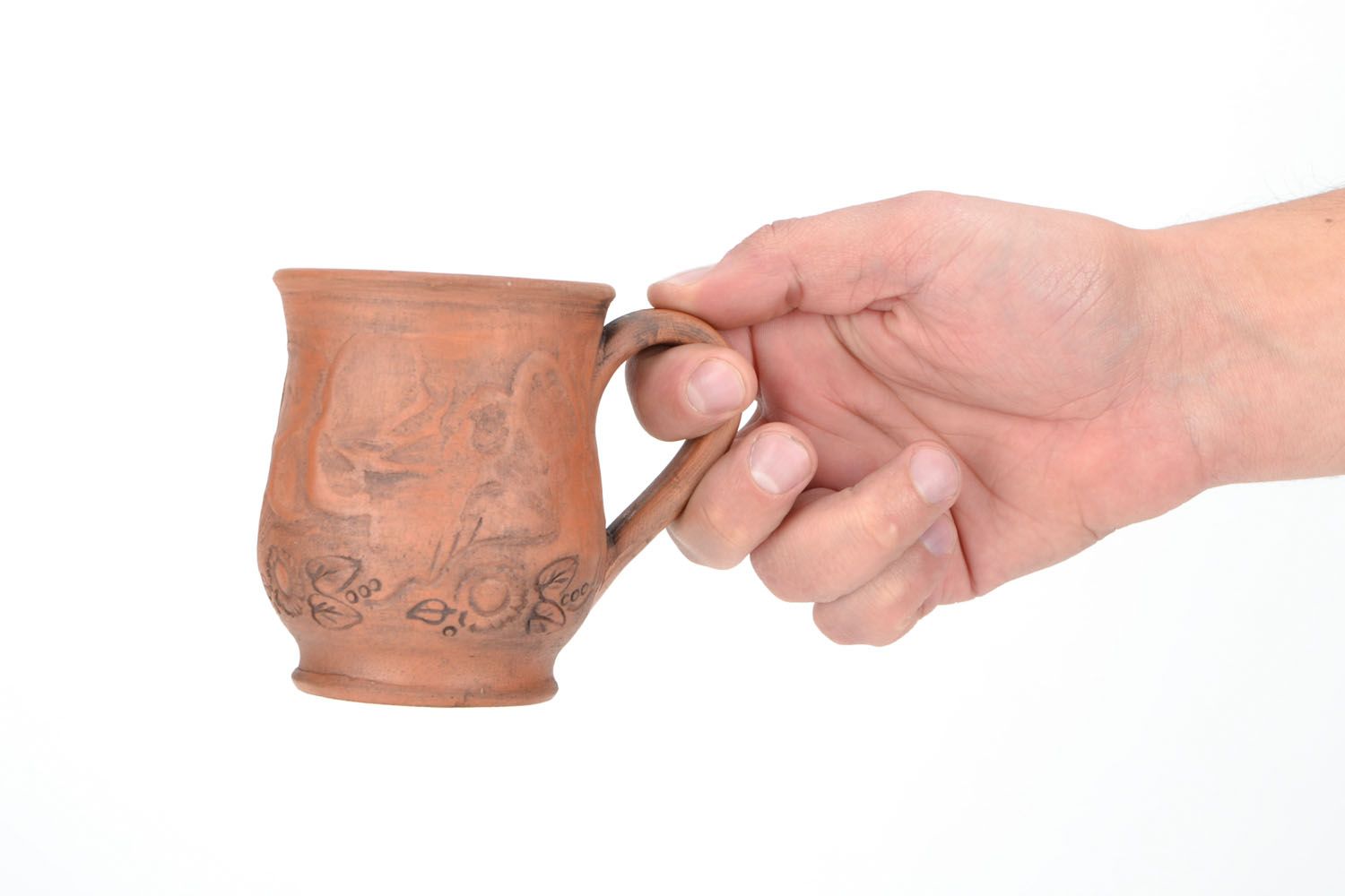Red clay drinking cup with rustic floral pattern photo 2