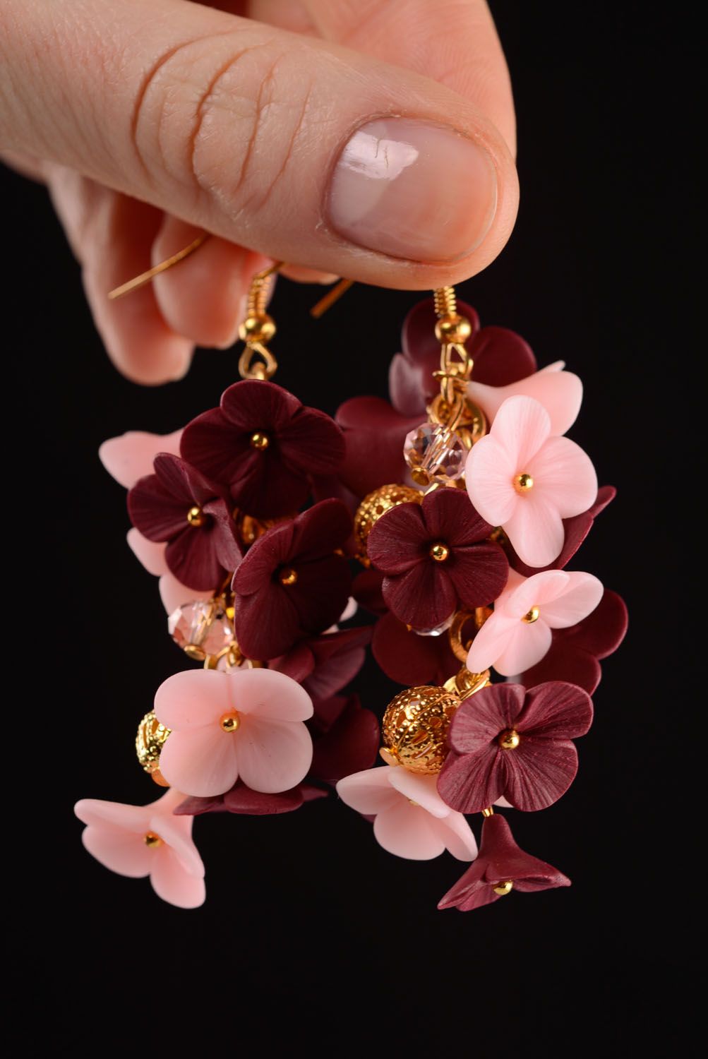 Beautiful earrings in the shape of flowers photo 2