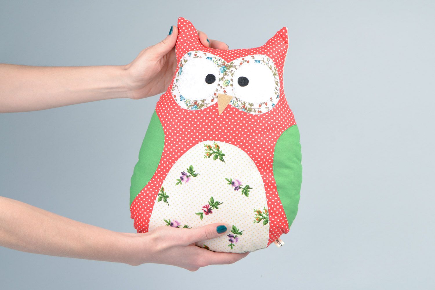 Handmade soft pillow pet sewn of cotton fabric in the shape of colorful owl photo 2