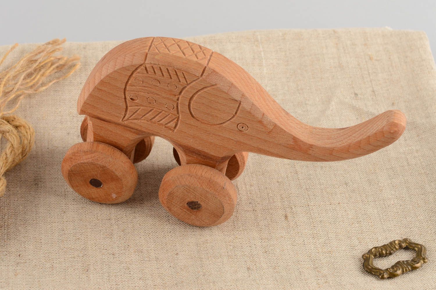 Handmade children's wooden wheeled toy elephant educational photo 1