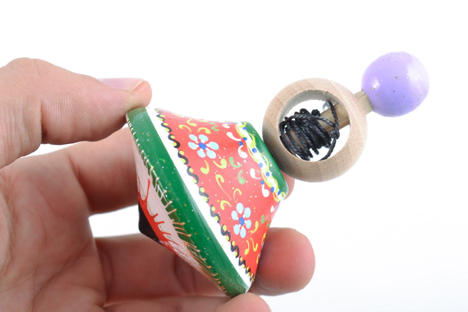 Wooden handmade spinning top decorated with eco-friendly paints  motor development photo 2