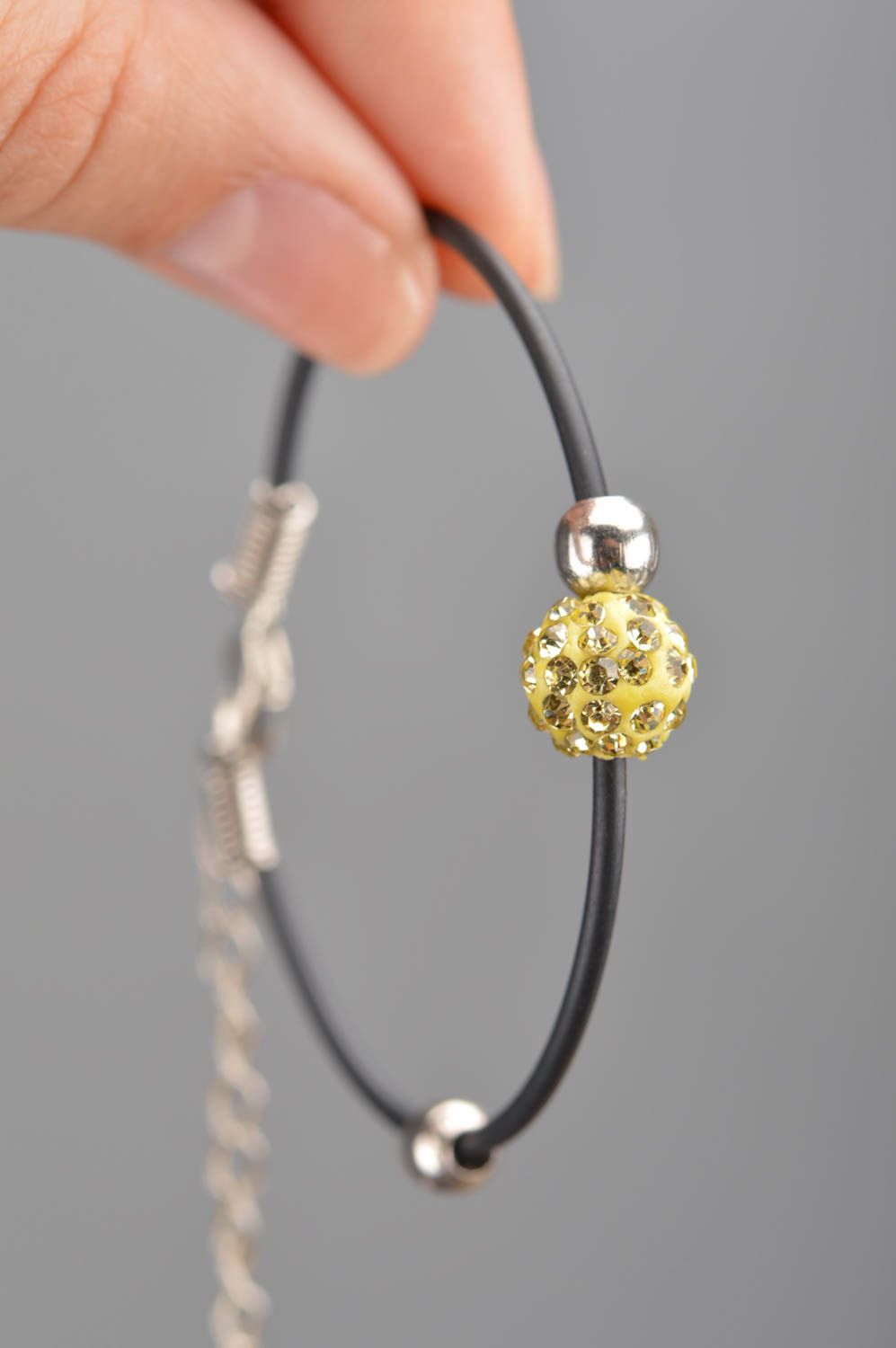 Simple handmade female bracelet made of rubber lace with bead Yellow ball photo 3