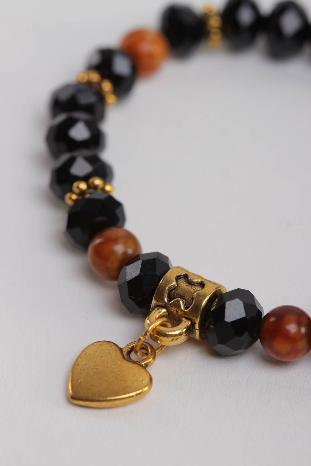 Stretchy beaded  black and cherry beads  gemstone bracelet with heart shape centerpiece photo 3