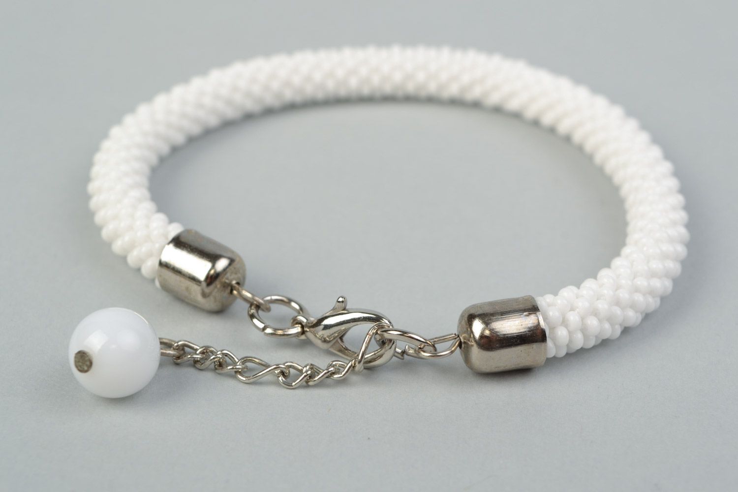 Handmade festive wrist cord bracelet crocheted of Czech beads in white color photo 4