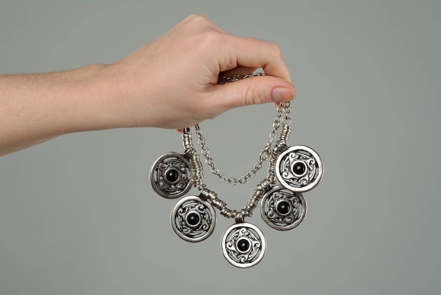 Metal necklace with a black cabochon photo 3