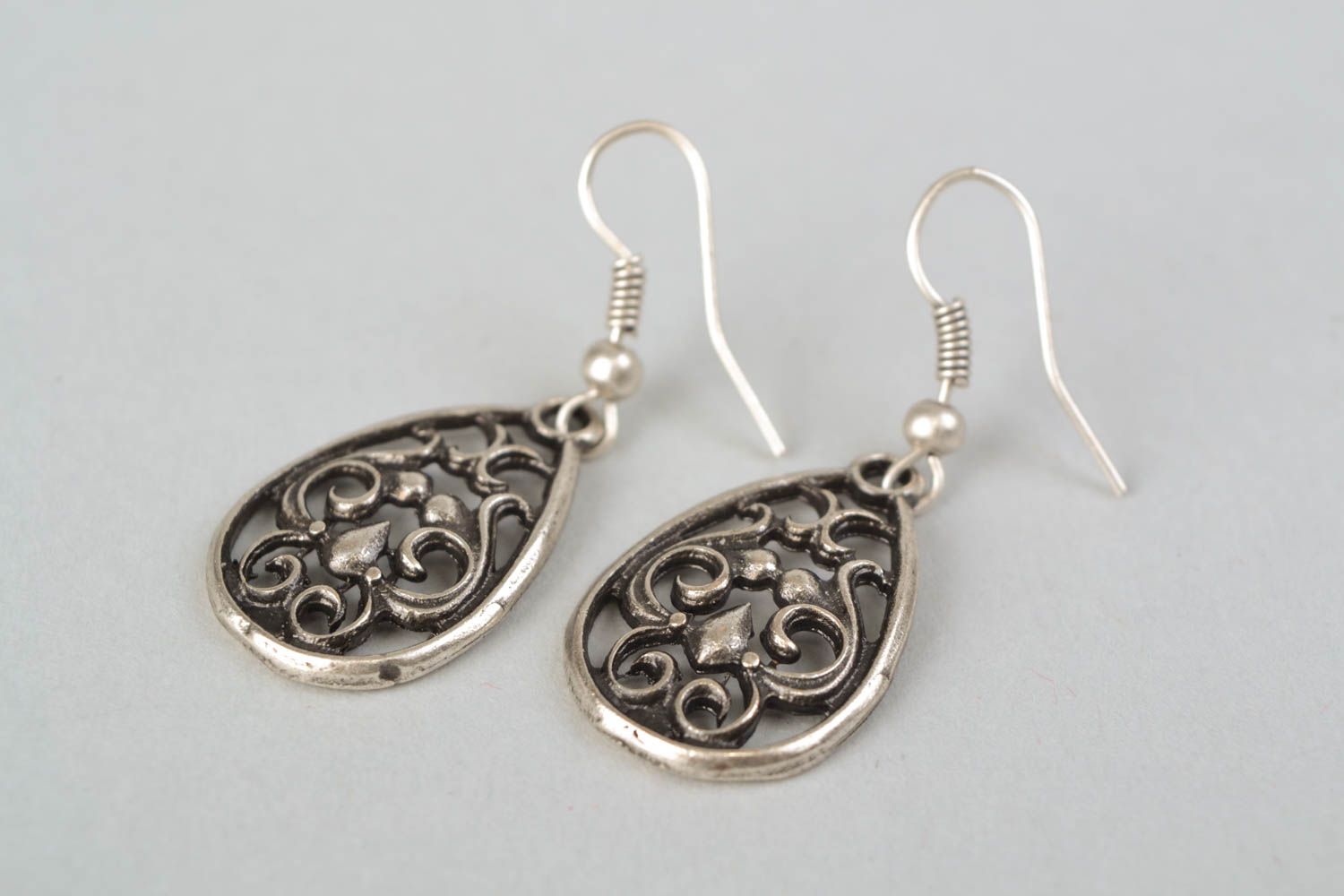 Lacy metal drop-shaped earrings photo 4