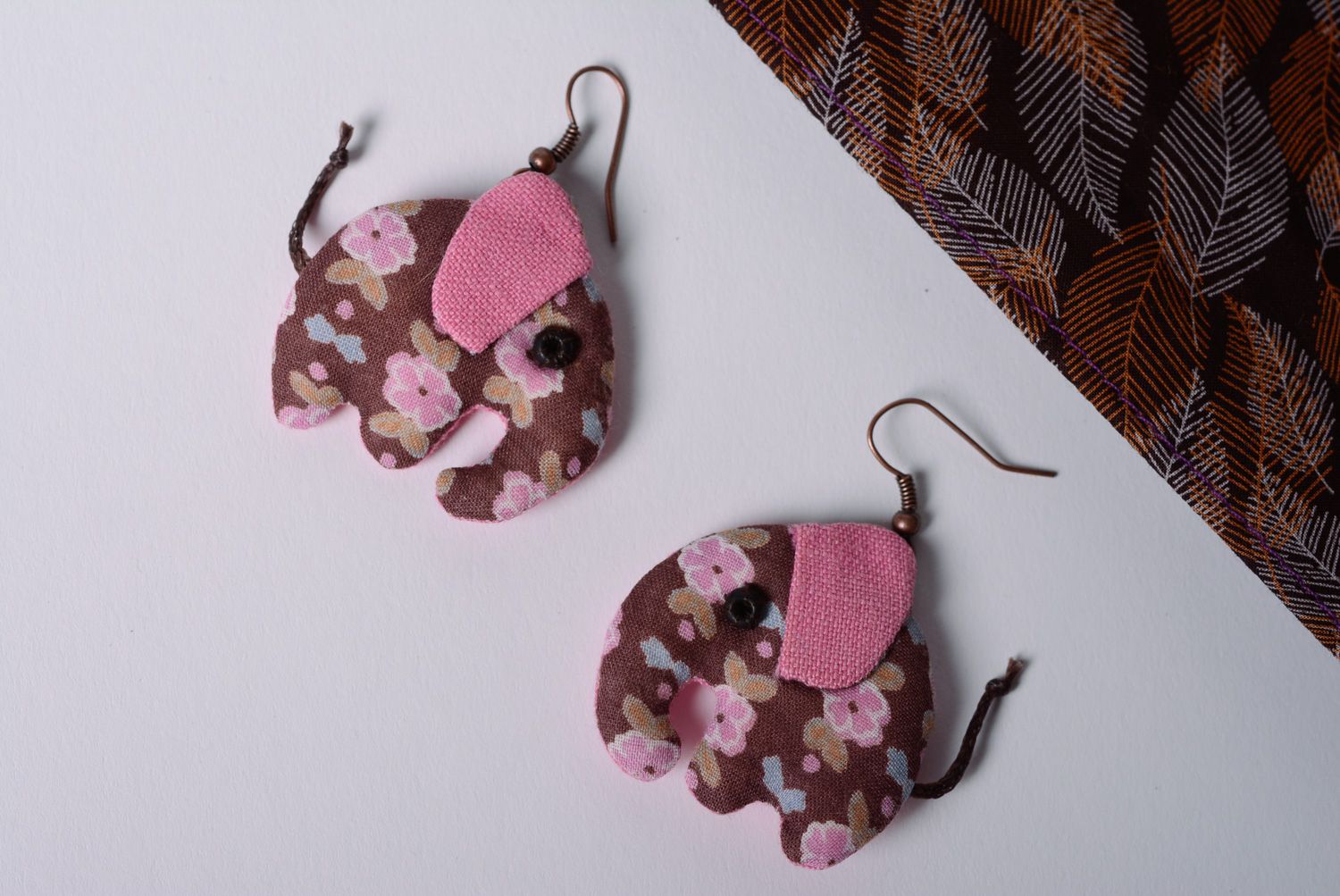 Handmade designer dangle earrings sewn of fabric elephants in pink color palette photo 1