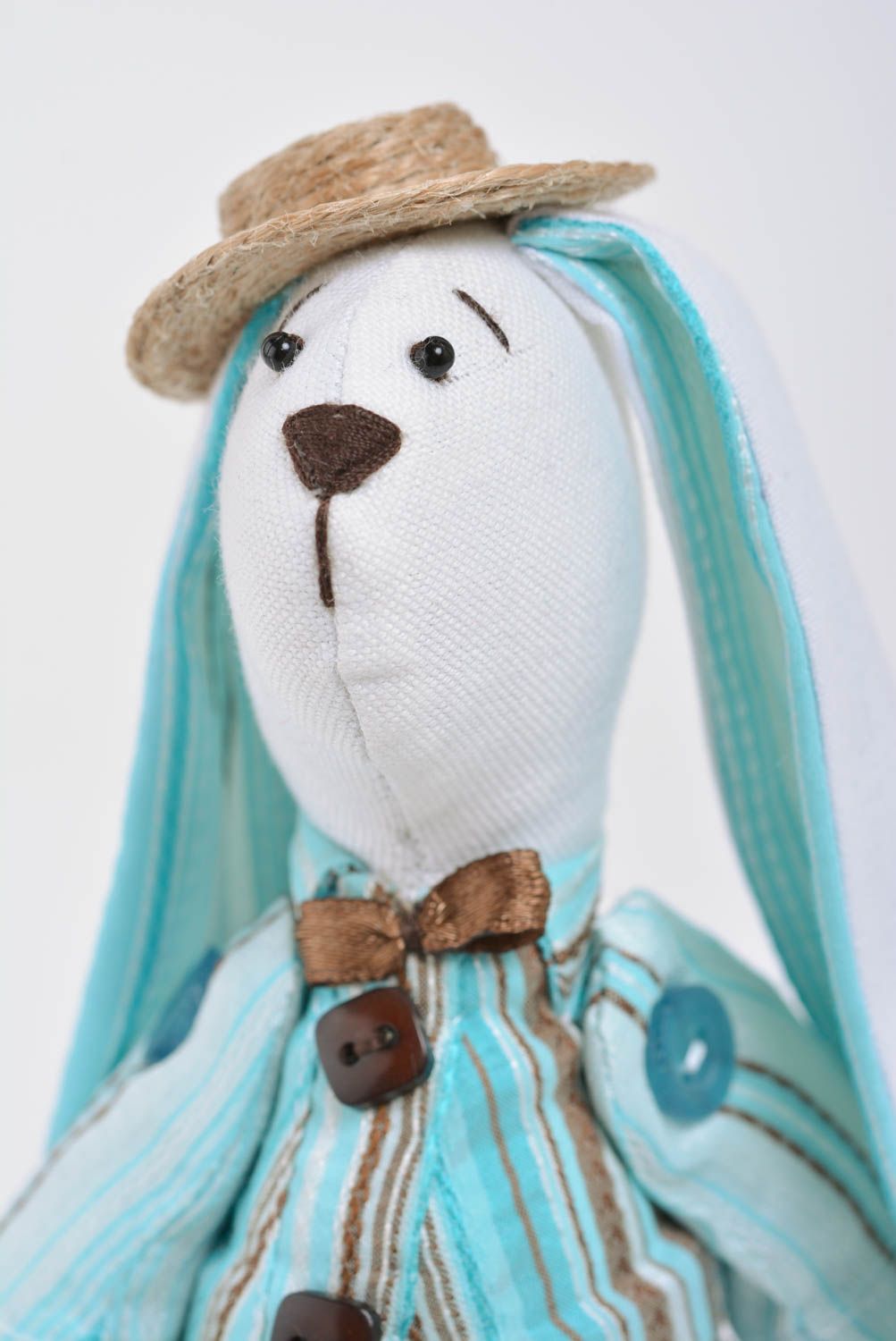 Handmade designer soft toy sewn of cotton rabbit in blue costume with bouquet photo 2