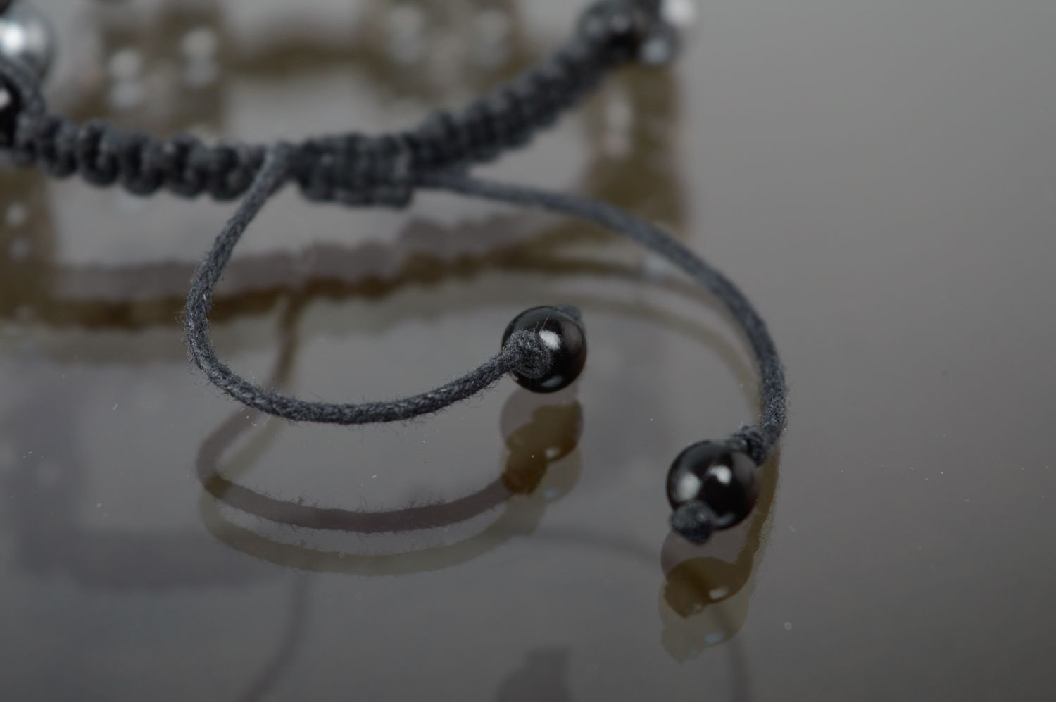Macrame bracelet with ceramic beads of silver color photo 4