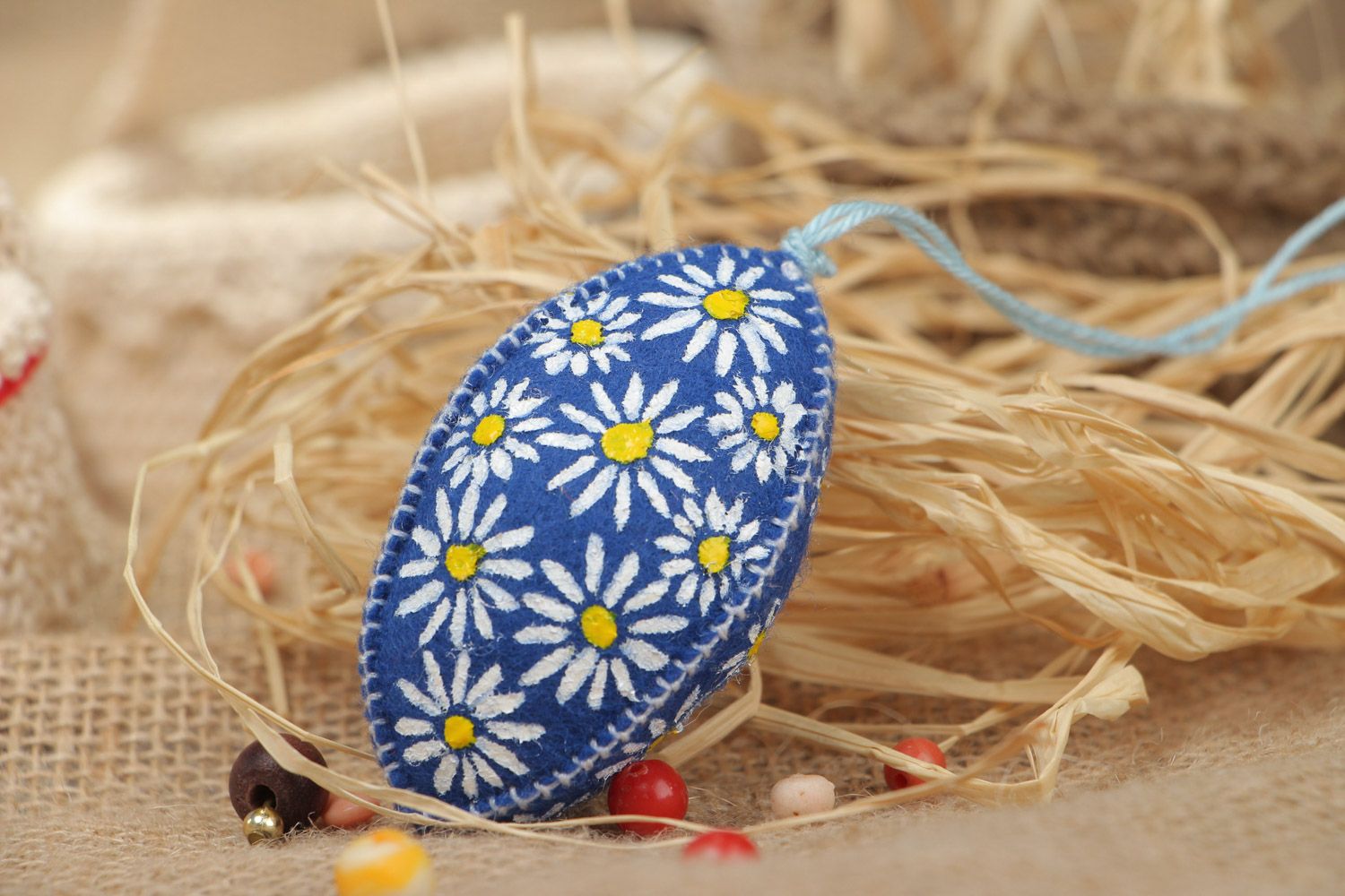 Handmade wall hanging Easter egg sewn of bright blue felt painted with flowers  photo 1
