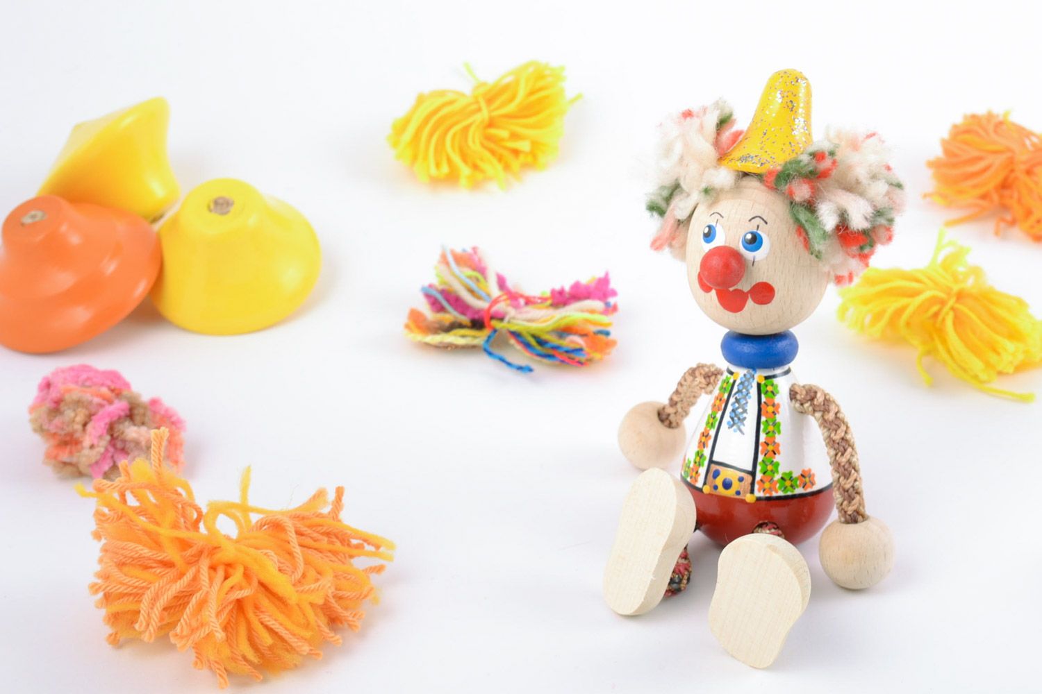 Bright homemade painted wooden toy in the shape of clown photo 1